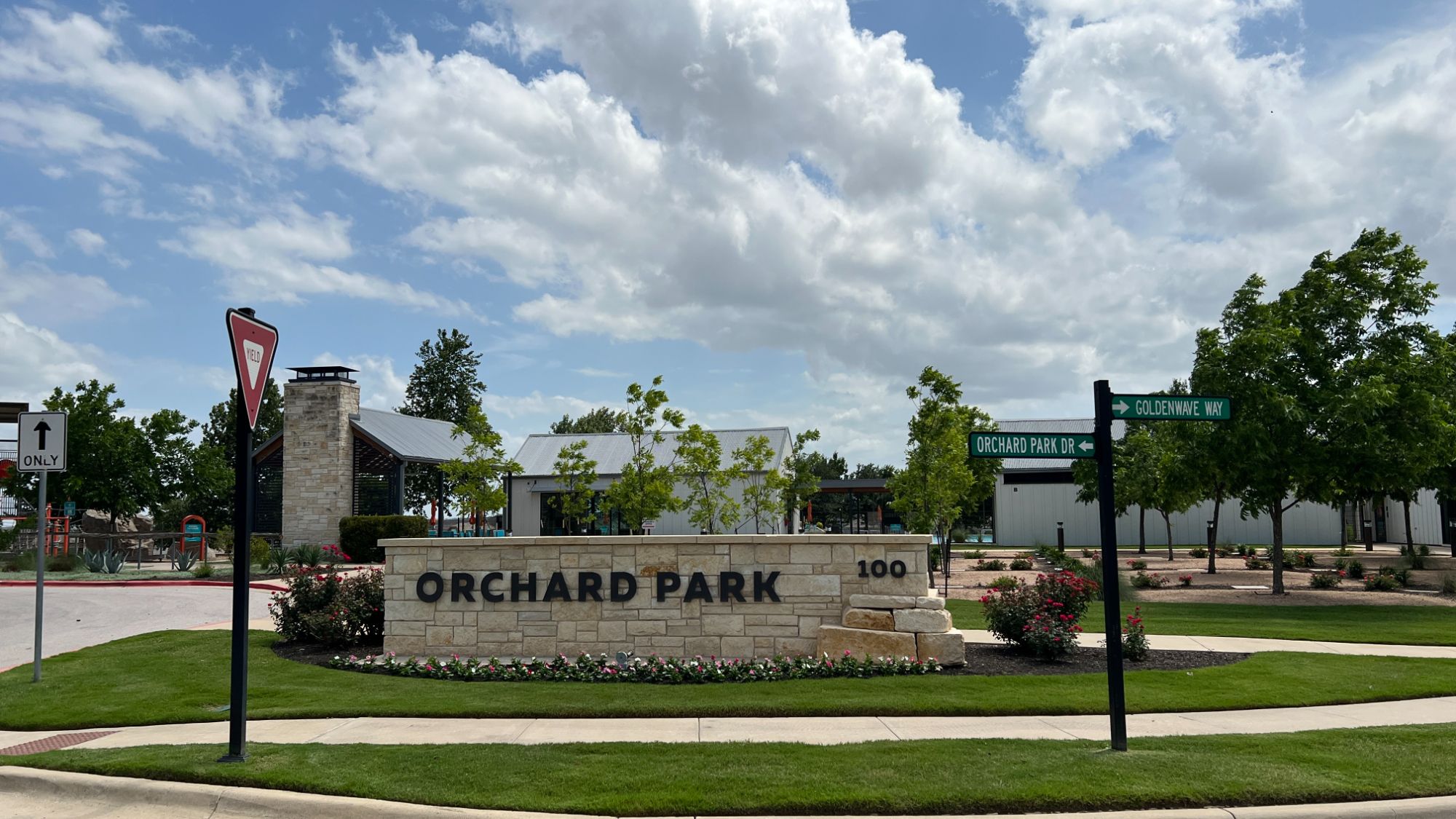 Orchard Park amenity center in Orchard Ridge Liberty Hill Texas with community clubhouse, landscaped grounds, and neighborhood gathering spaces