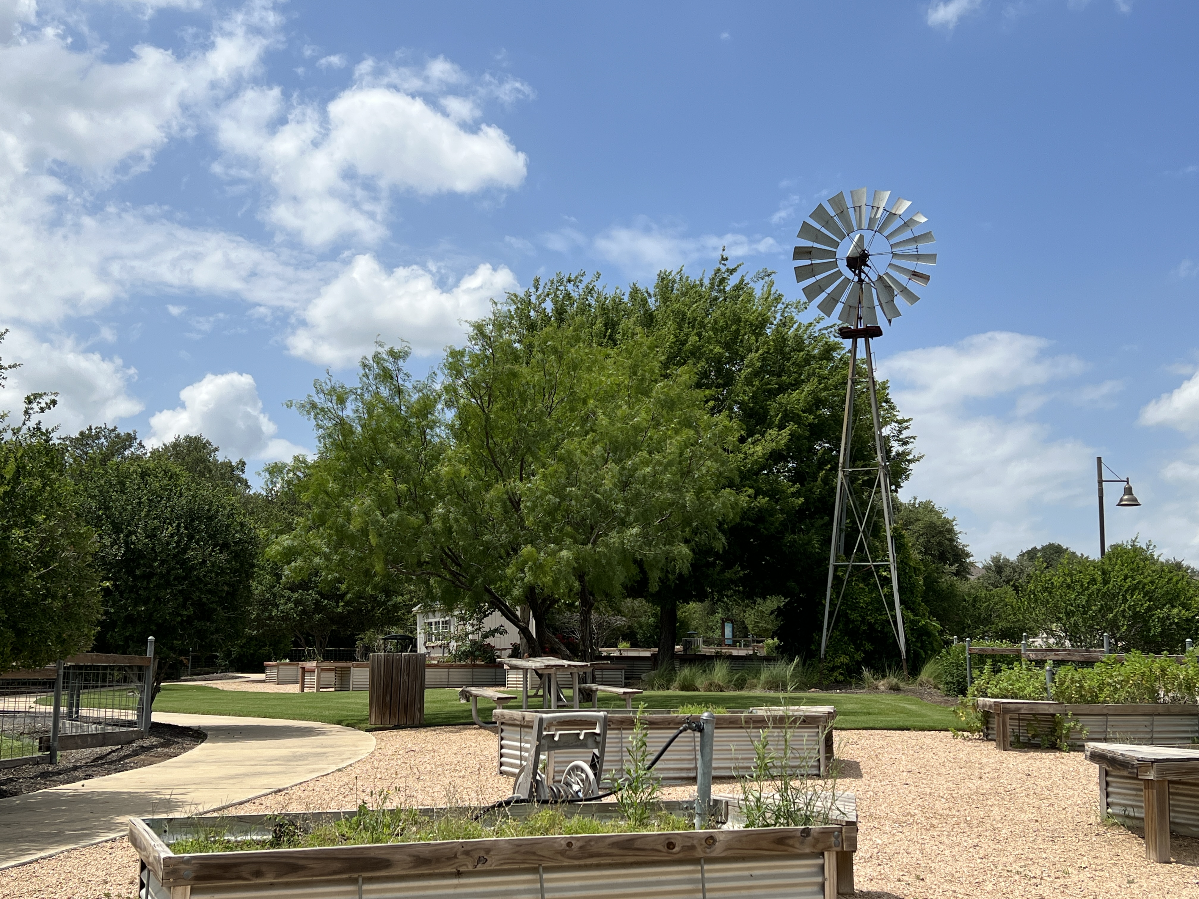 Founders Garden in Orchard Ridge Liberty Hill Texas with raised garden beds, walking paths, and community green space