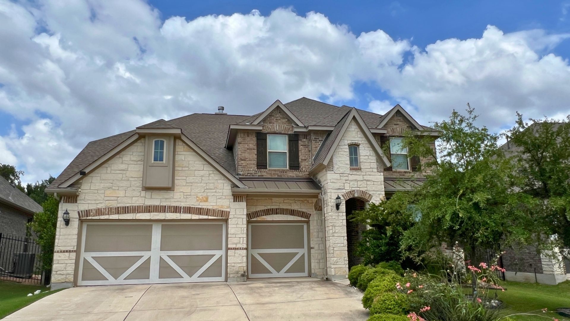 Single-family home in Larkspur in Leander Texas with suburban design and front yard landscaping