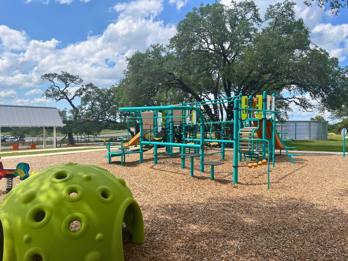 Outdoor playground and recreation area at The Paddock in Saddleback at Santa Rita Ranch Liberty Hill Texas