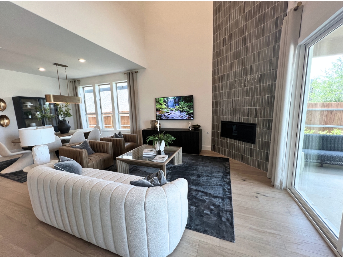 Open-concept Pulte living room in Saddleback at Santa Rita Ranch Liberty Hill Texas