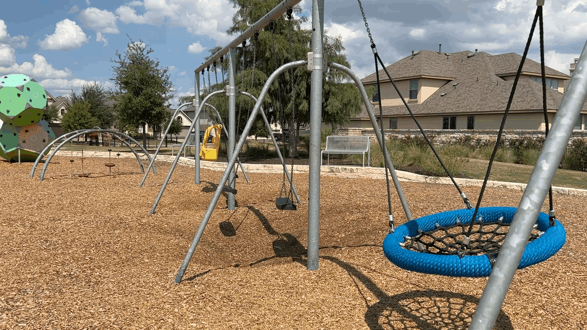 Playground swings and family recreation area at Santa Rita Ranch in Liberty Hill Texas