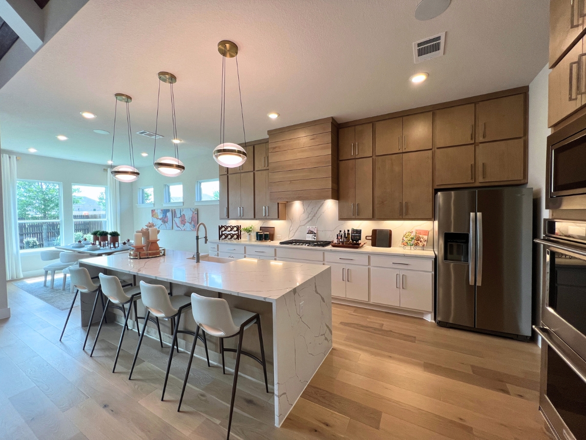 GFO kitchen with large island in Saddleback at Santa Rita Ranch Liberty Hill Texas