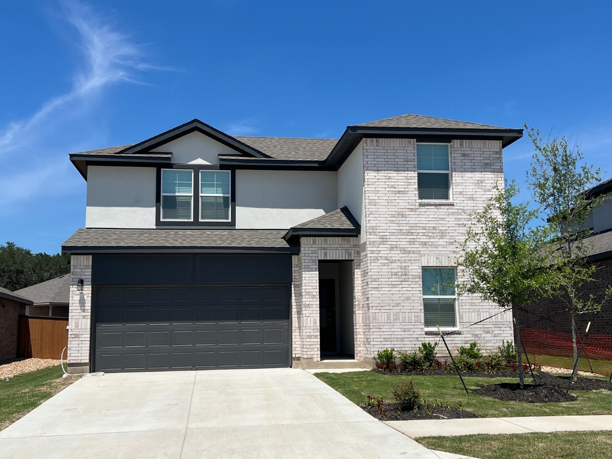 Newer brick and stone home in Bar W Ranch in Leander, Texas.