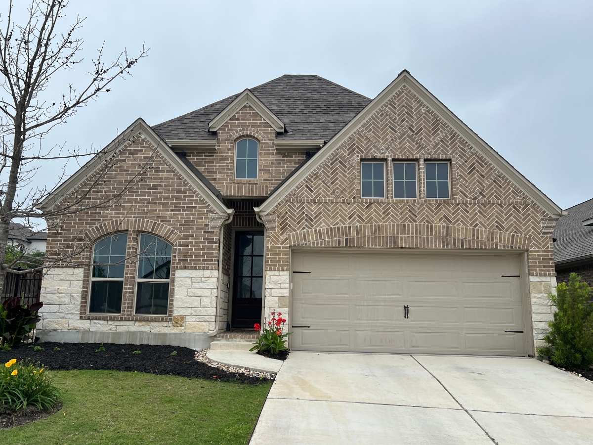 Brick home exterior in Rancho Sienna community in Georgetown, Texas