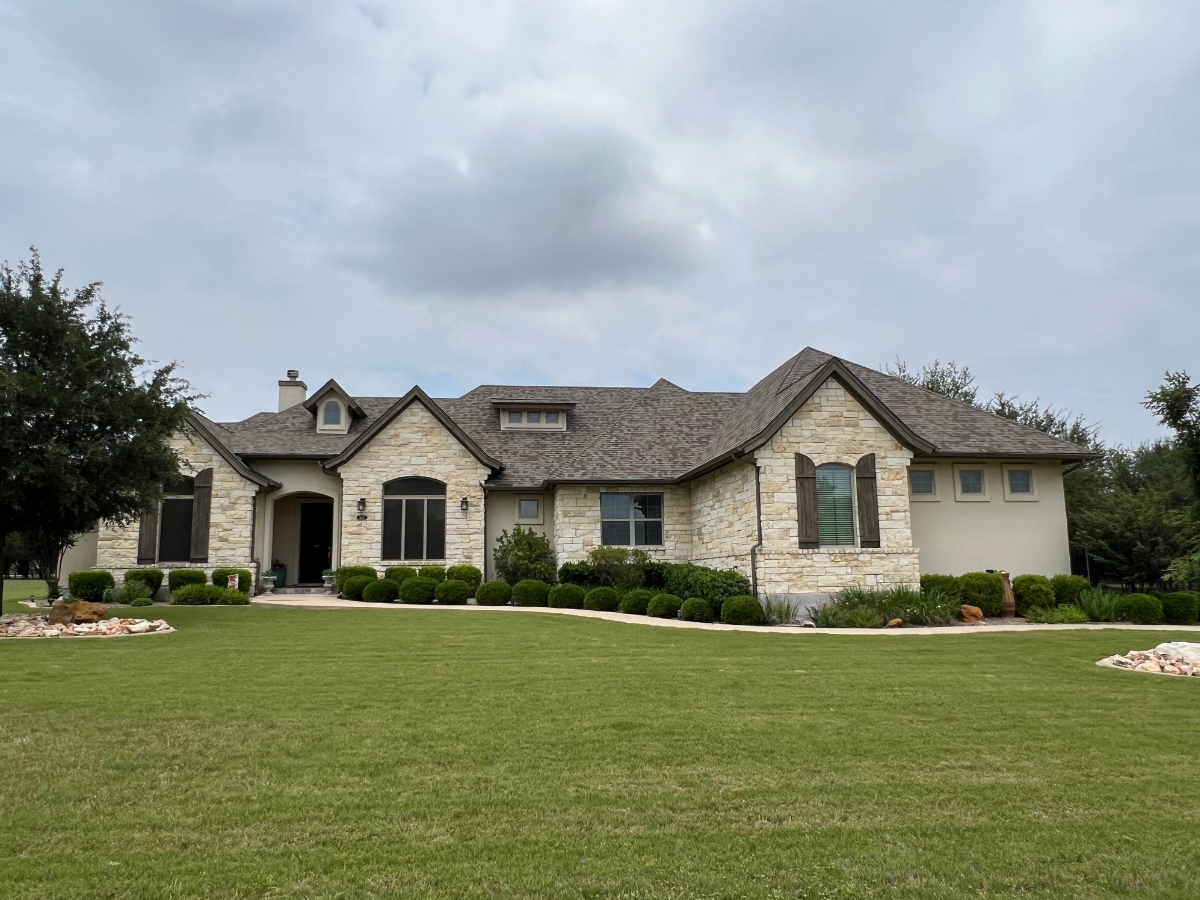 Wide neighborhood view in Reagan's Overlook Leander Texas showing larger homesites