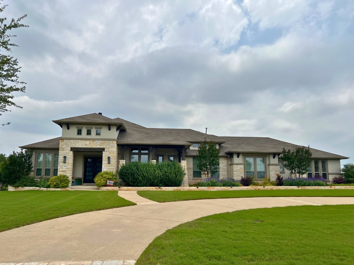 Street view of Reagan's Overlook in Leander Texas showing larger homesites