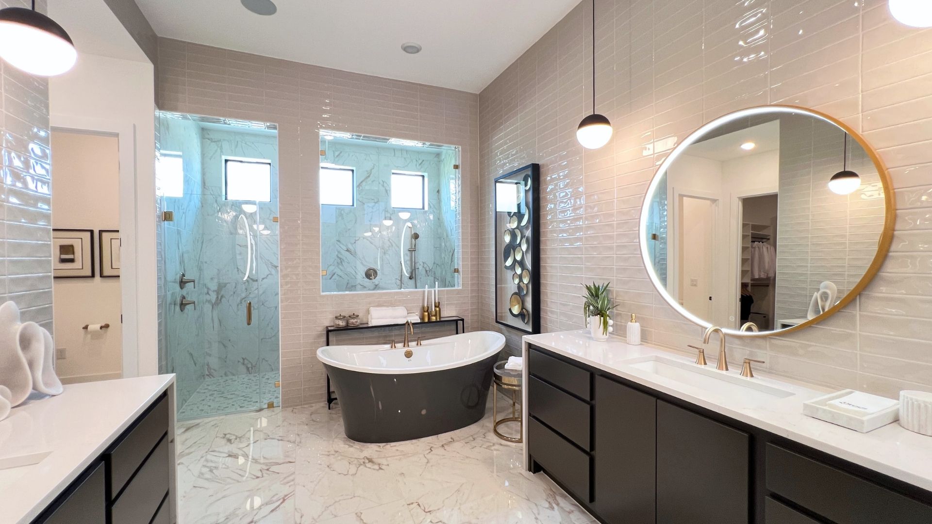 Luxury primary bathroom with soaking tub and oversized walk-in shower in the Drees McKennan model home at Hilltop Ranch in Leander, Texas