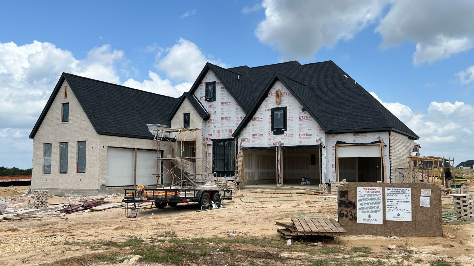 New home under construction in Hilltop Ranch, a luxury acre-lot community in Leander Texas