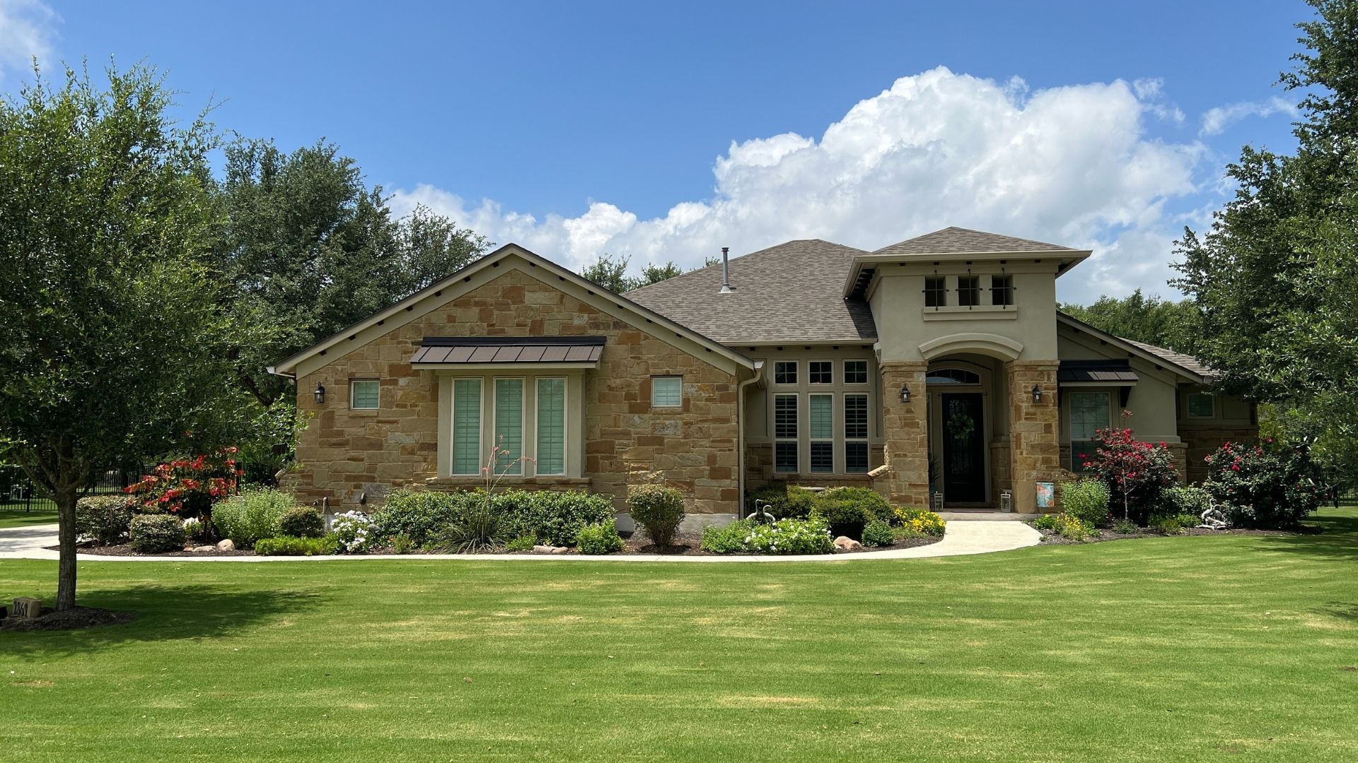 Greatwood home with mature landscaping on a one-acre homesite in Leander, Texas