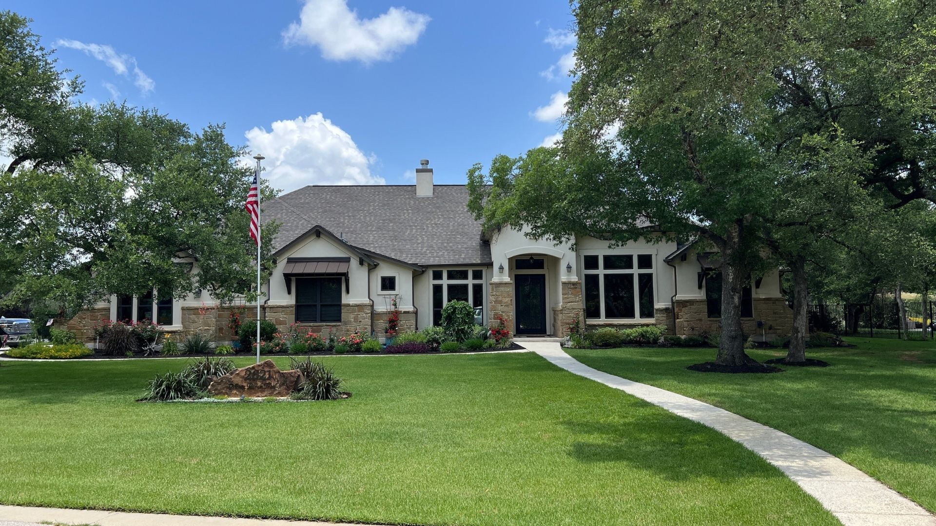 Established Greatwood home with mature landscaping and one-acre homesite in Leander, Texas