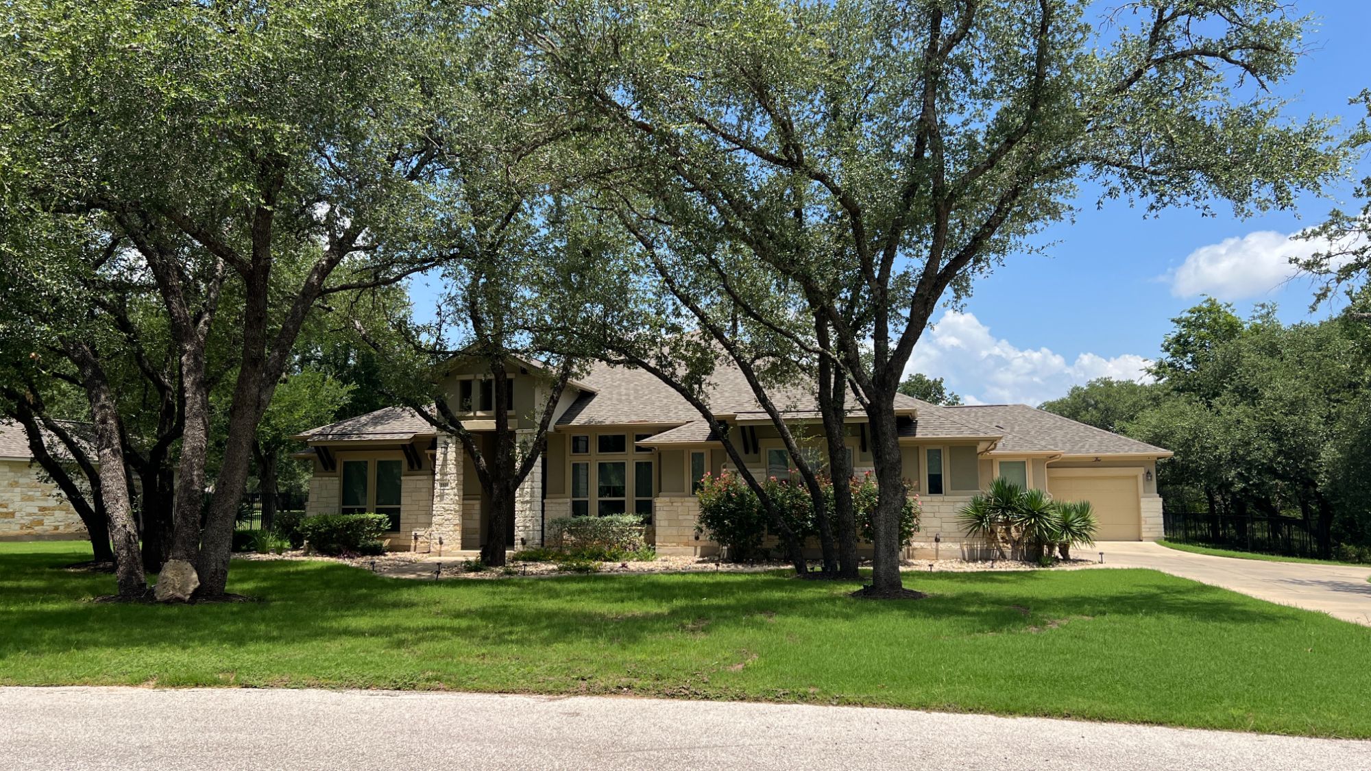 Greatwood home with mature landscaping in an established acre-lot community near Leander Estates in Leander, Texas