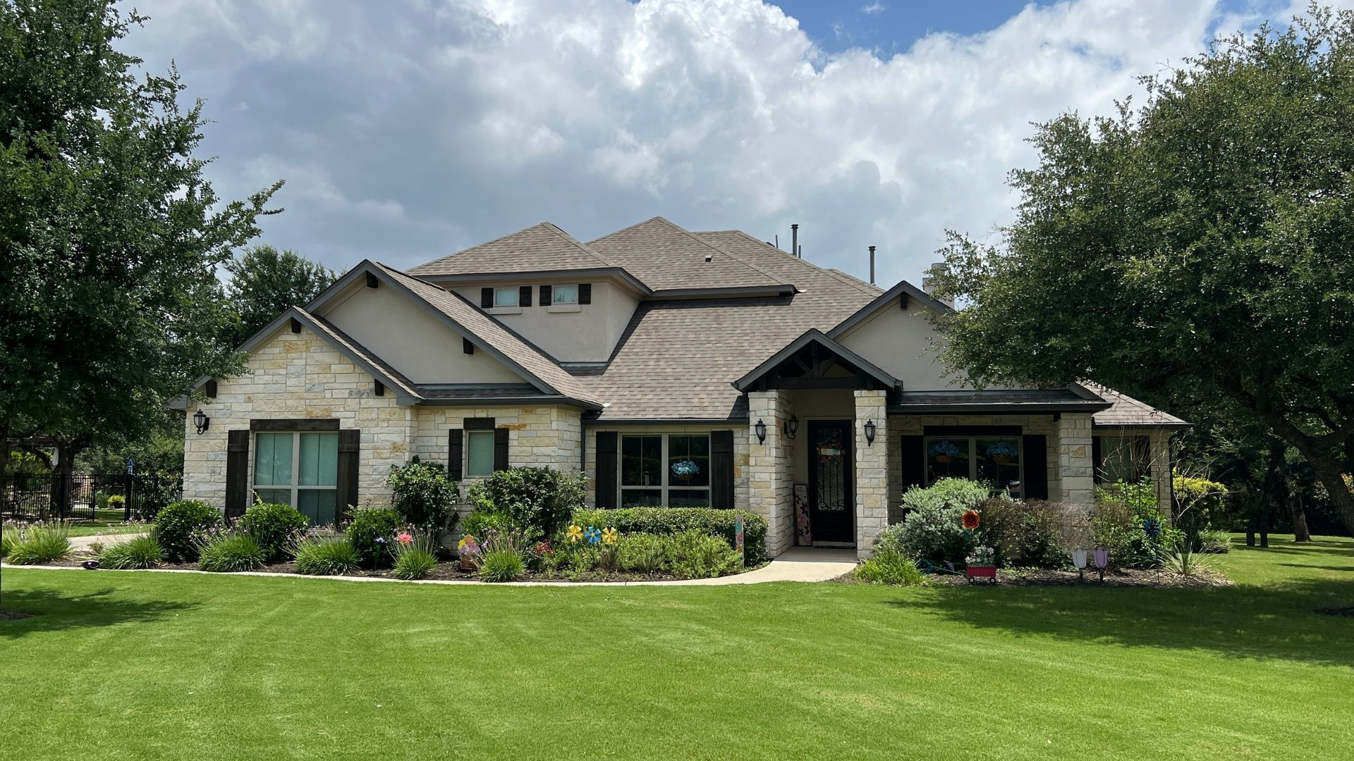 Greatwood home with mature trees and established landscaping in a Leander acre-lot community