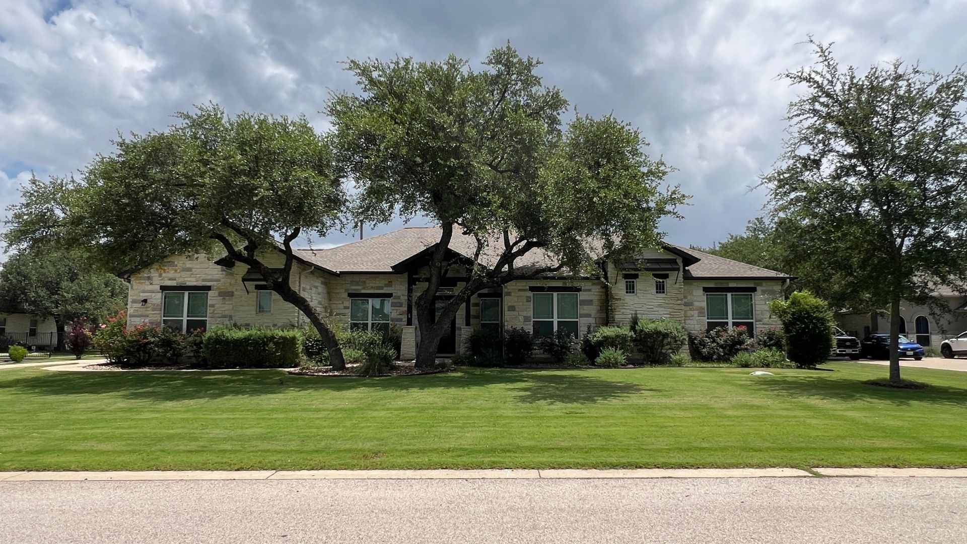 Greatwood home with mature trees on a one-acre homesite in Leander, Texas
