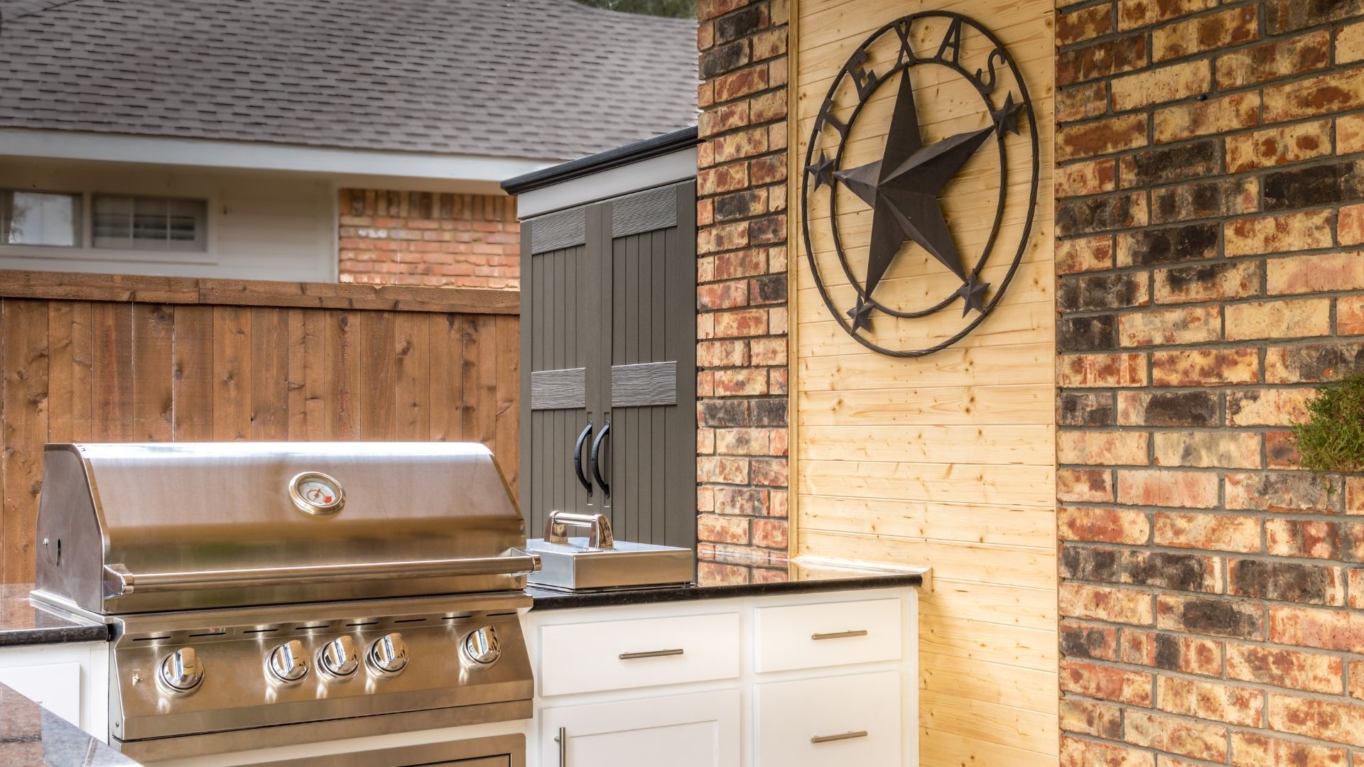 Outdoor kitchen and backyard entertaining space in Santa Rita Ranch