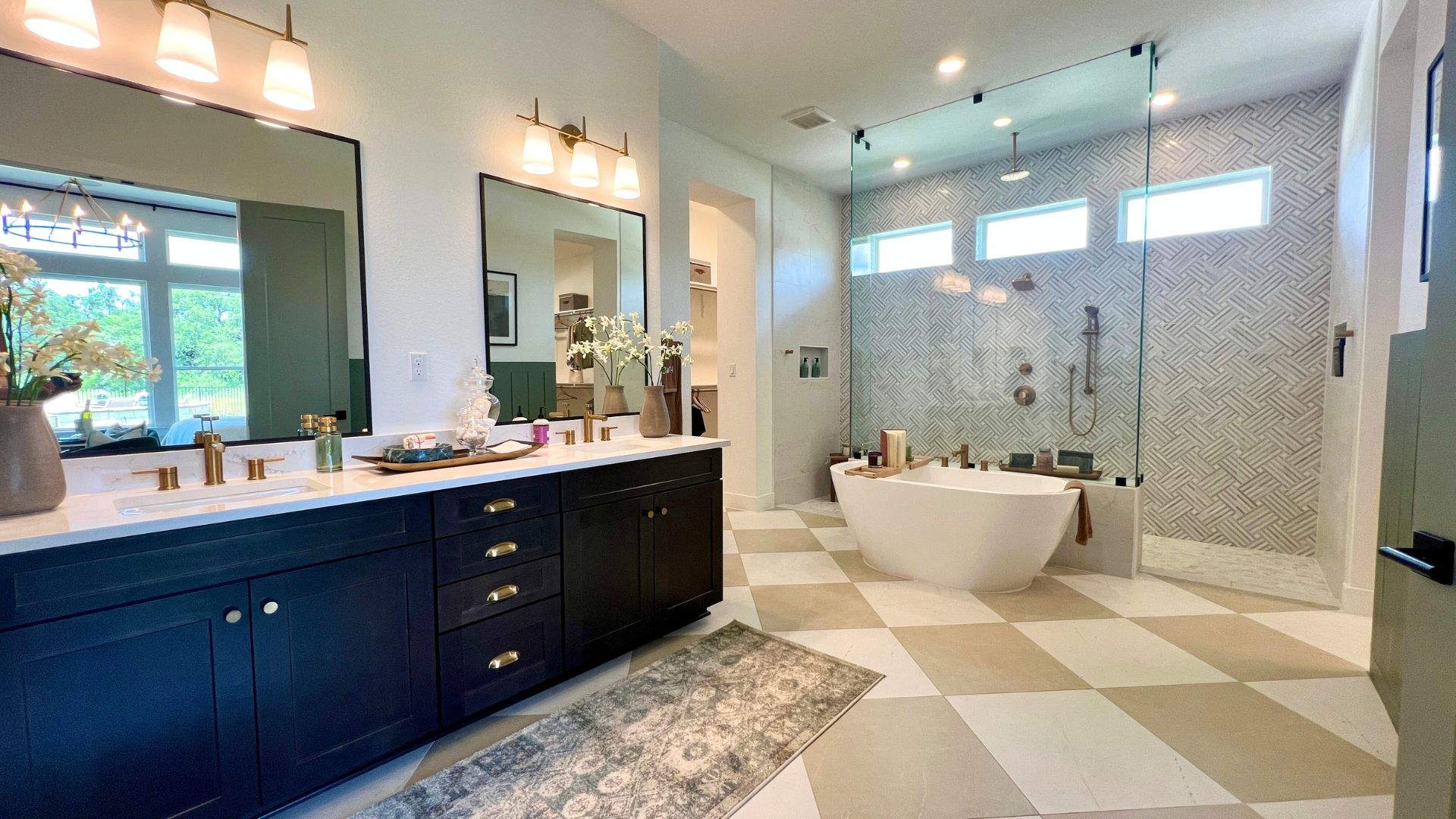 Luxury primary bathroom with freestanding soaking tub and walk-in shower in the David Weekley Monterey model home at Leander Estates in Leander Texas