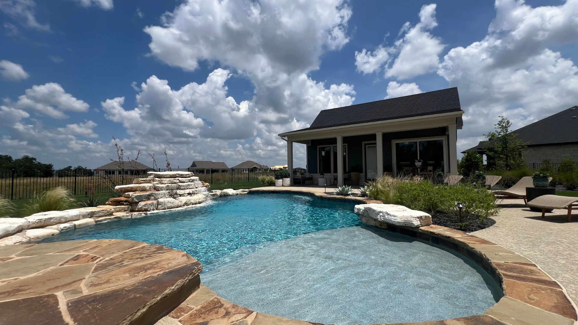 Backyard oasis with pool and detached casita at the David Weekley Monterey model home in Leander Estates in Leander Texas