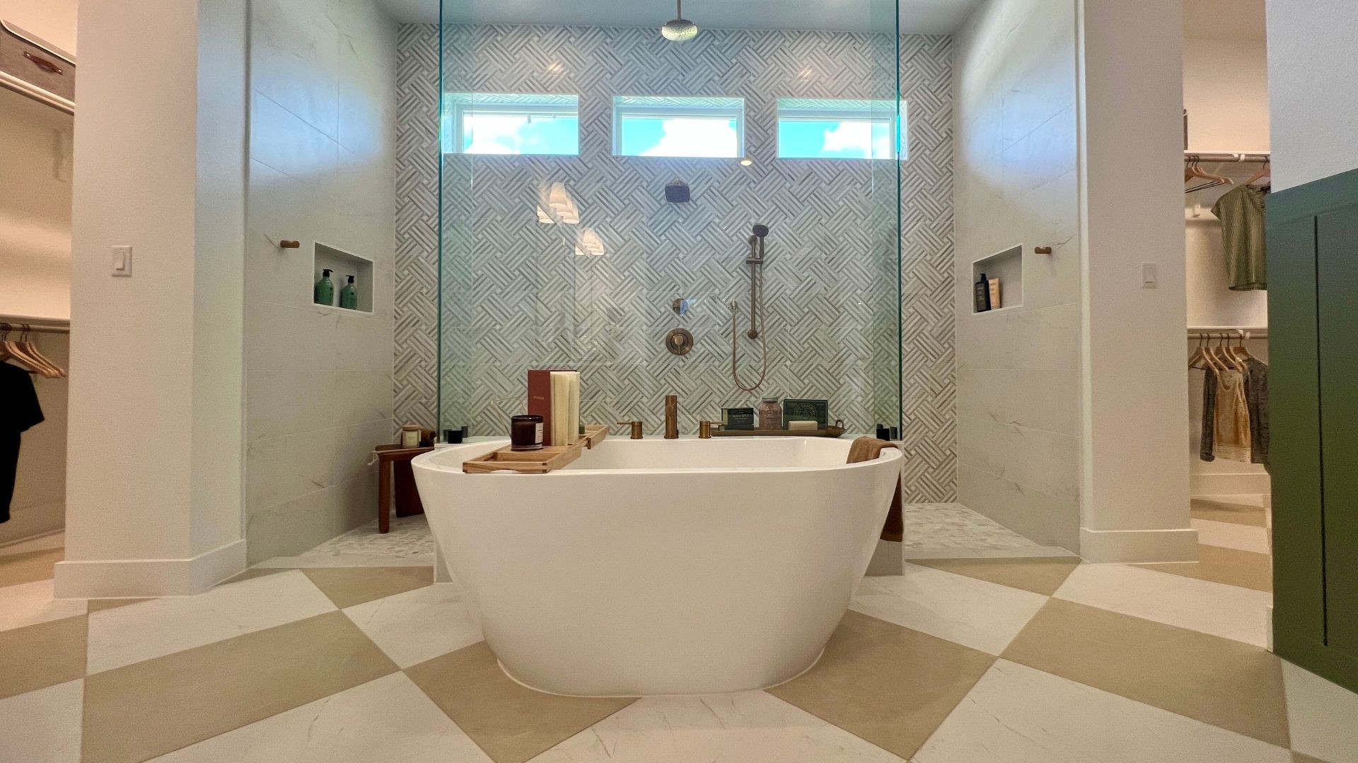 Freestanding soaking tub in the luxury primary bathroom of the David Weekley Monterey model home at Leander Estates in Leander Texas