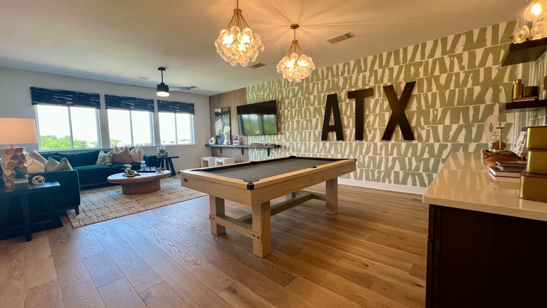 Spacious game room and entertainment space in the David Weekley Monterey model home at Leander Estates in Leander Texas