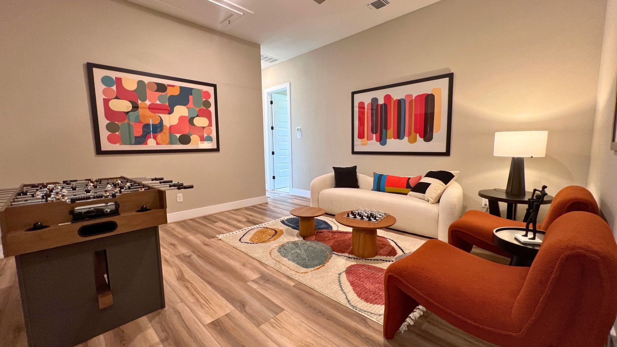 Large game room and entertainment space in the Scott Felder Bulverde model home at Leander Estates in Leander Texas