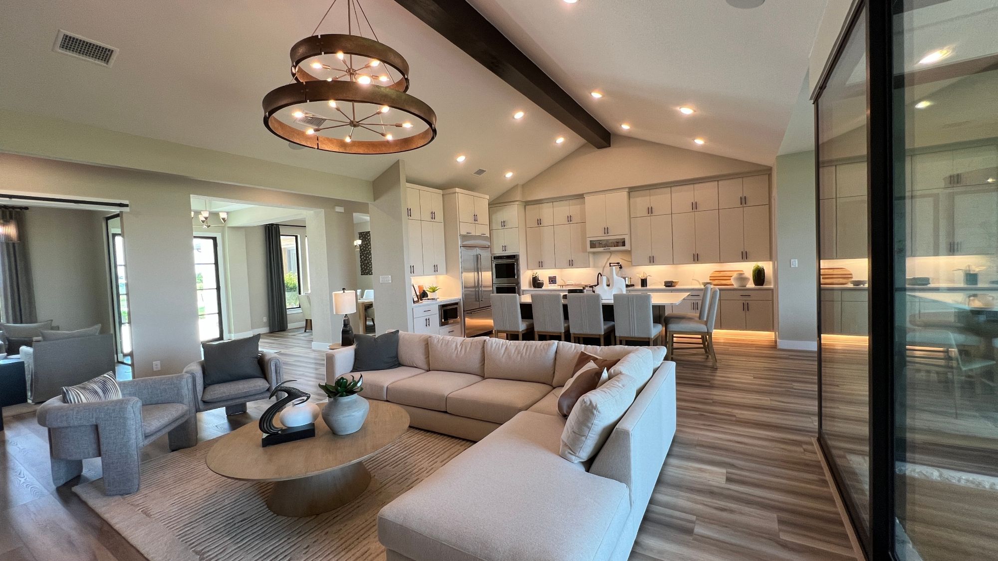Open concept living room and kitchen in the Scott Felder Bulverde model home at Leander Estates in Leander Texas