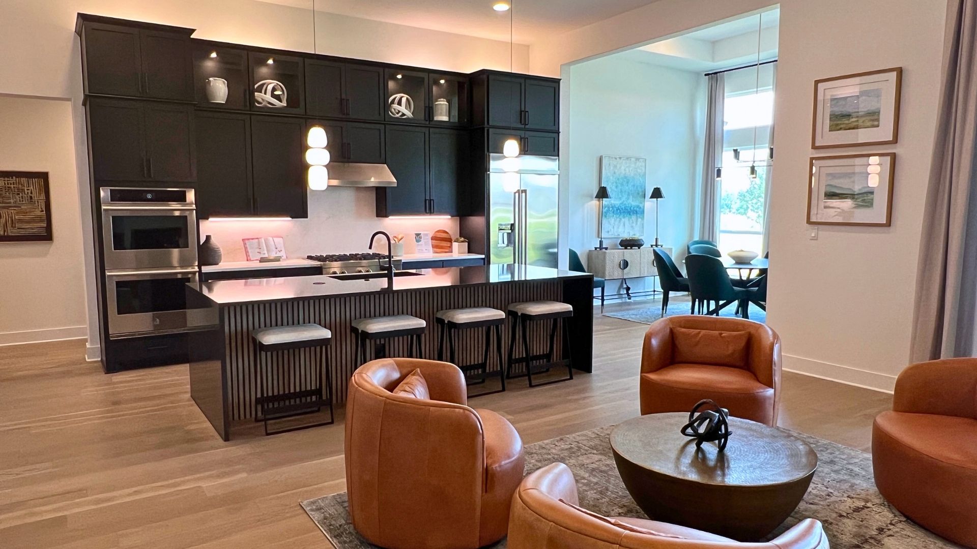 Lounge seating area near the kitchen in the Giddens Kerrville model home at Leander Estates in Leander Texas