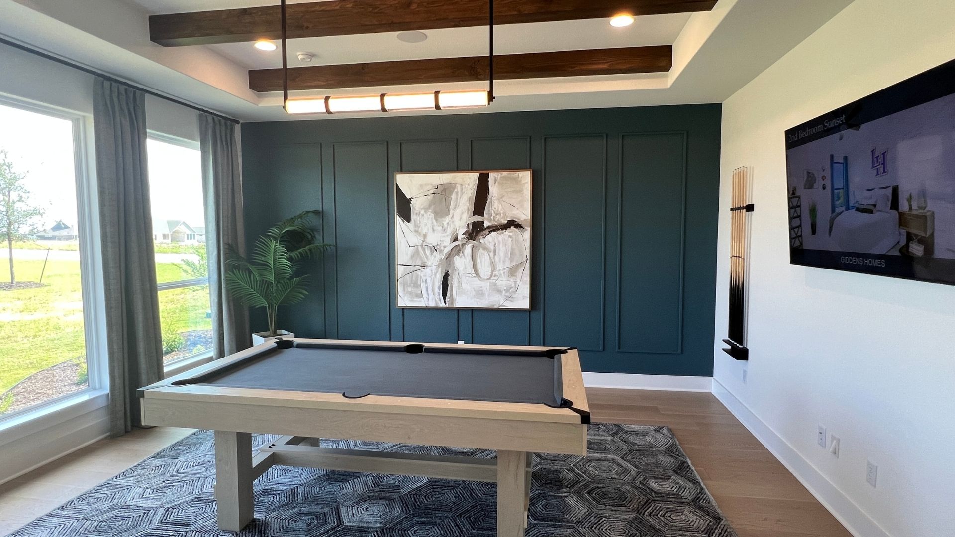 Large game room and entertaining space in the Giddens Kerrville model home at Leander Estates in Leander Texas