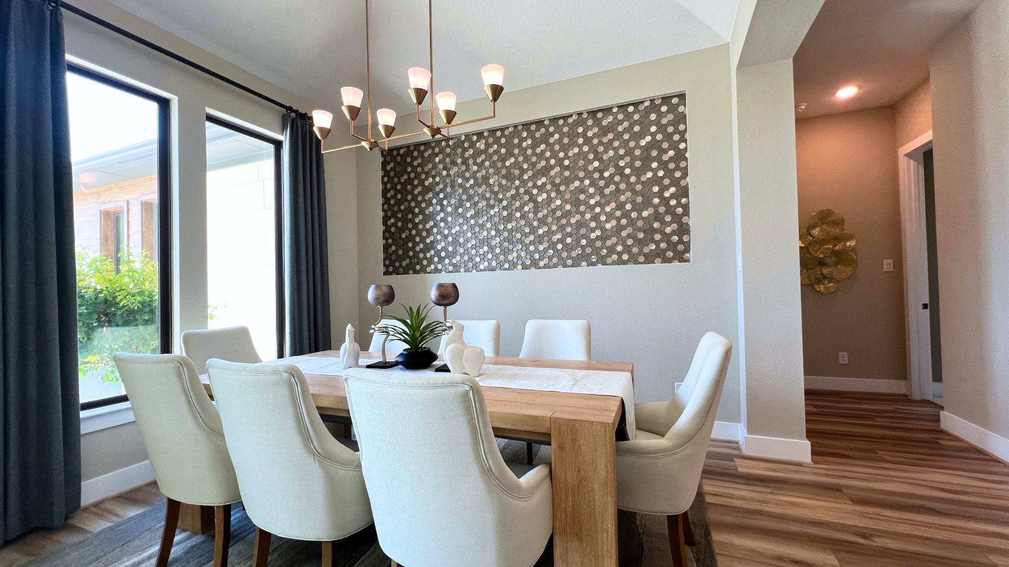 Formal dining room with designer finishes in the Scott Felder Bulverde model home at Leander Estates in Leander Texas