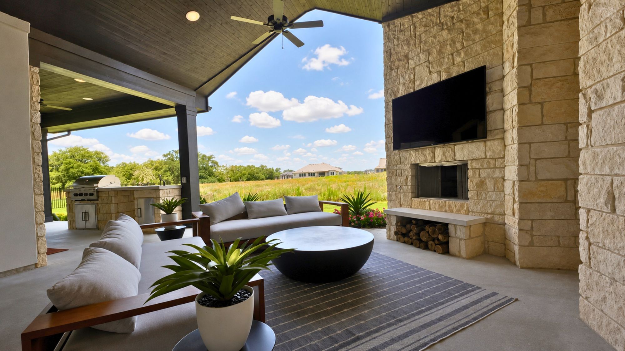 Covered outdoor living area in the Scott Felder Bulverde model home at Leander Estates in Leander Texas