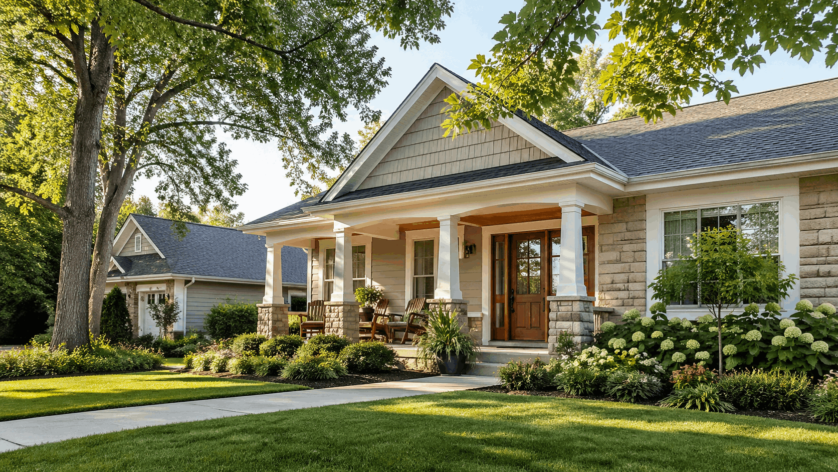 Sunlit single-story home with a welcoming porch and mature trees in a Fox River Valley suburb