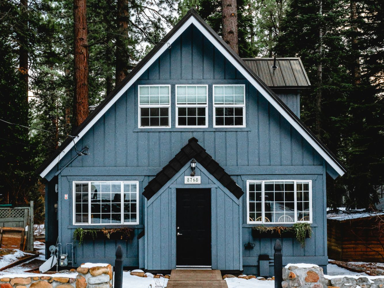 Luxury Nevada Lake Tahoe home showing roof snow shed direction and winter snow accumulation