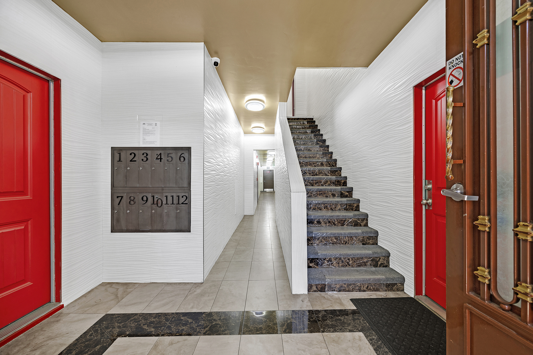 1921 26th Avenue entry hall with red doors