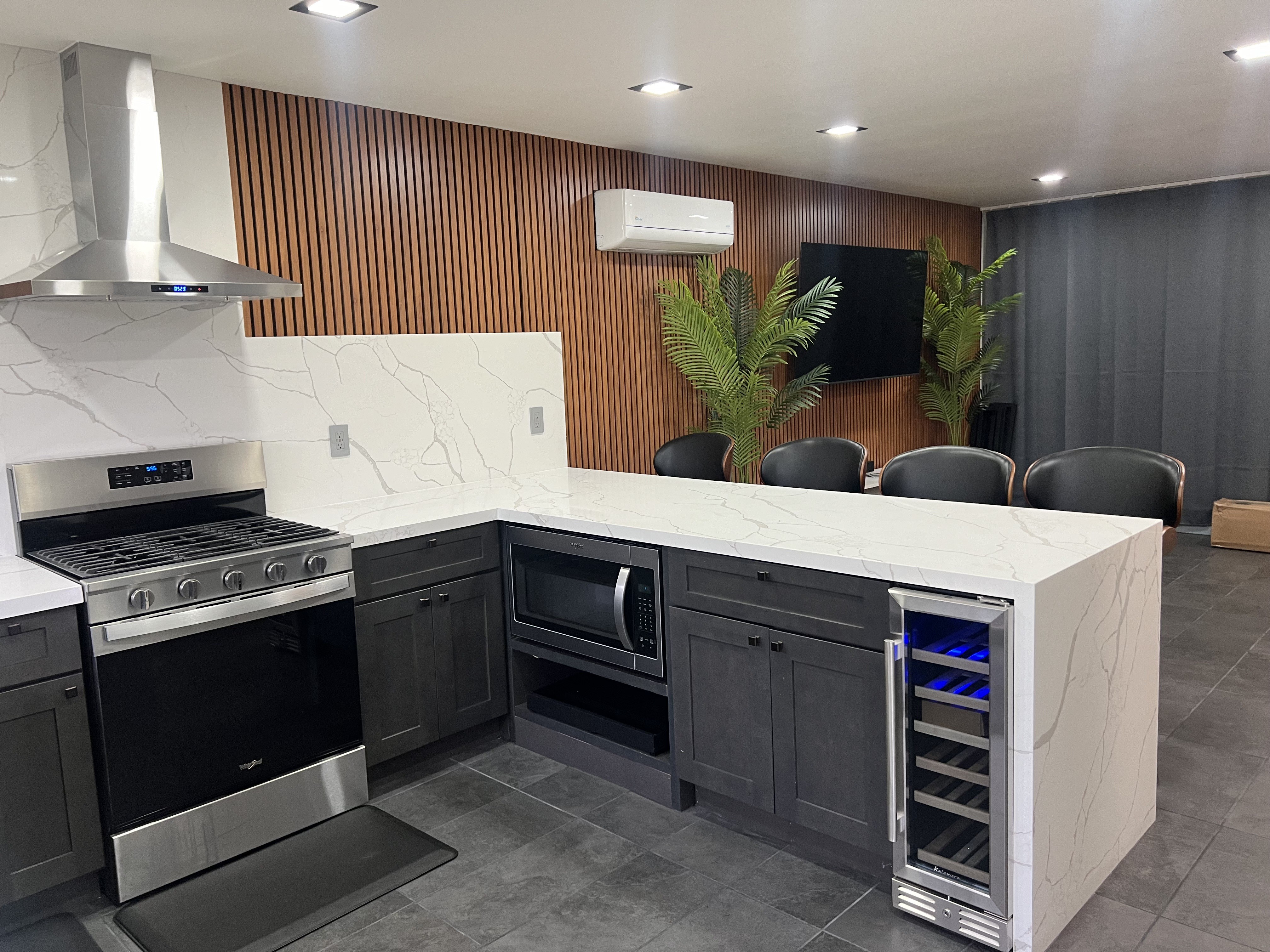 Kitchen island and living area at 3000 Nicol Avenue