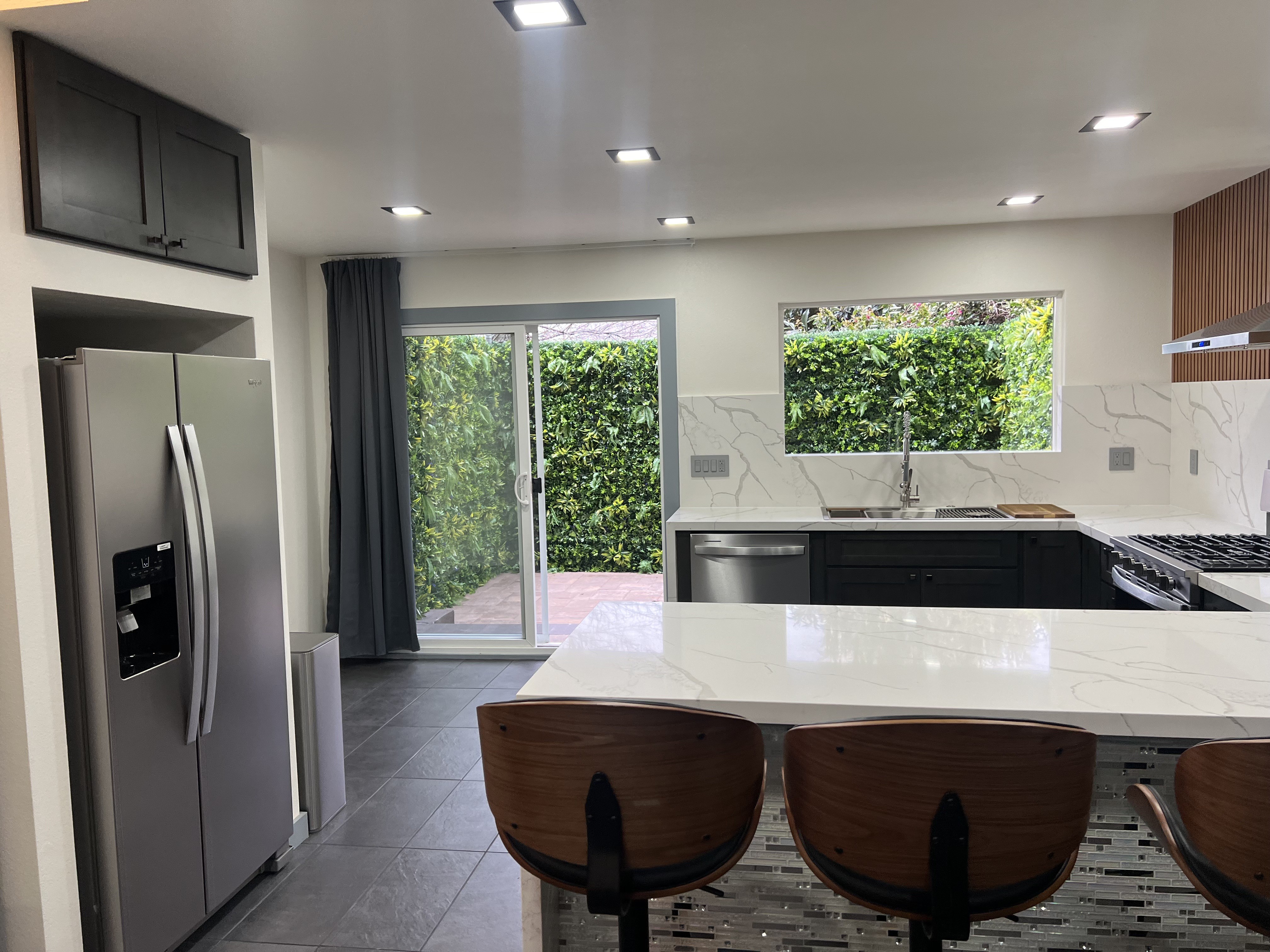 Renovated kitchen and breakfast bar at 3000 Nicol Avenue