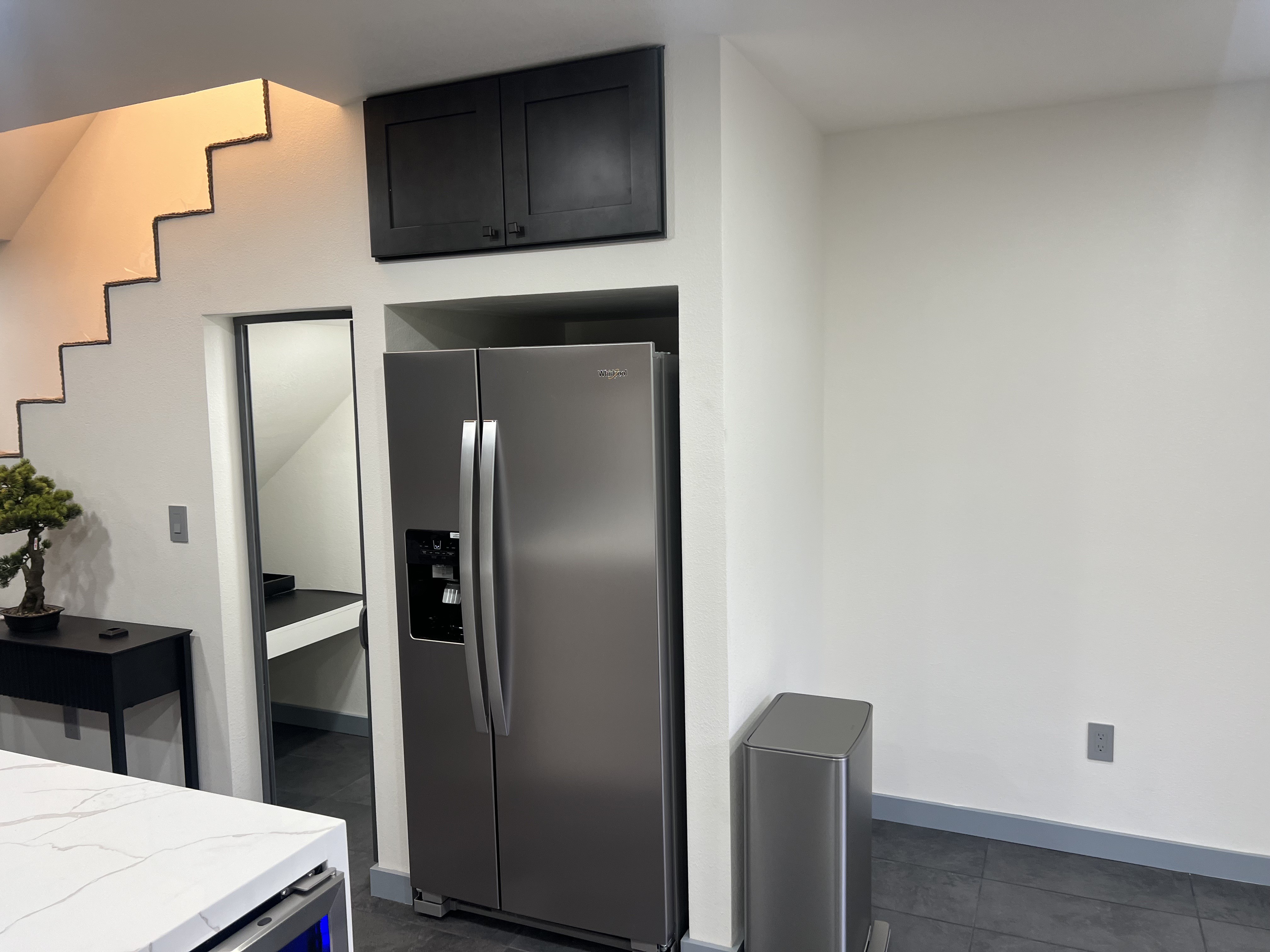 Refrigerator and storage cabinetry at 3000 Nicol Avenue