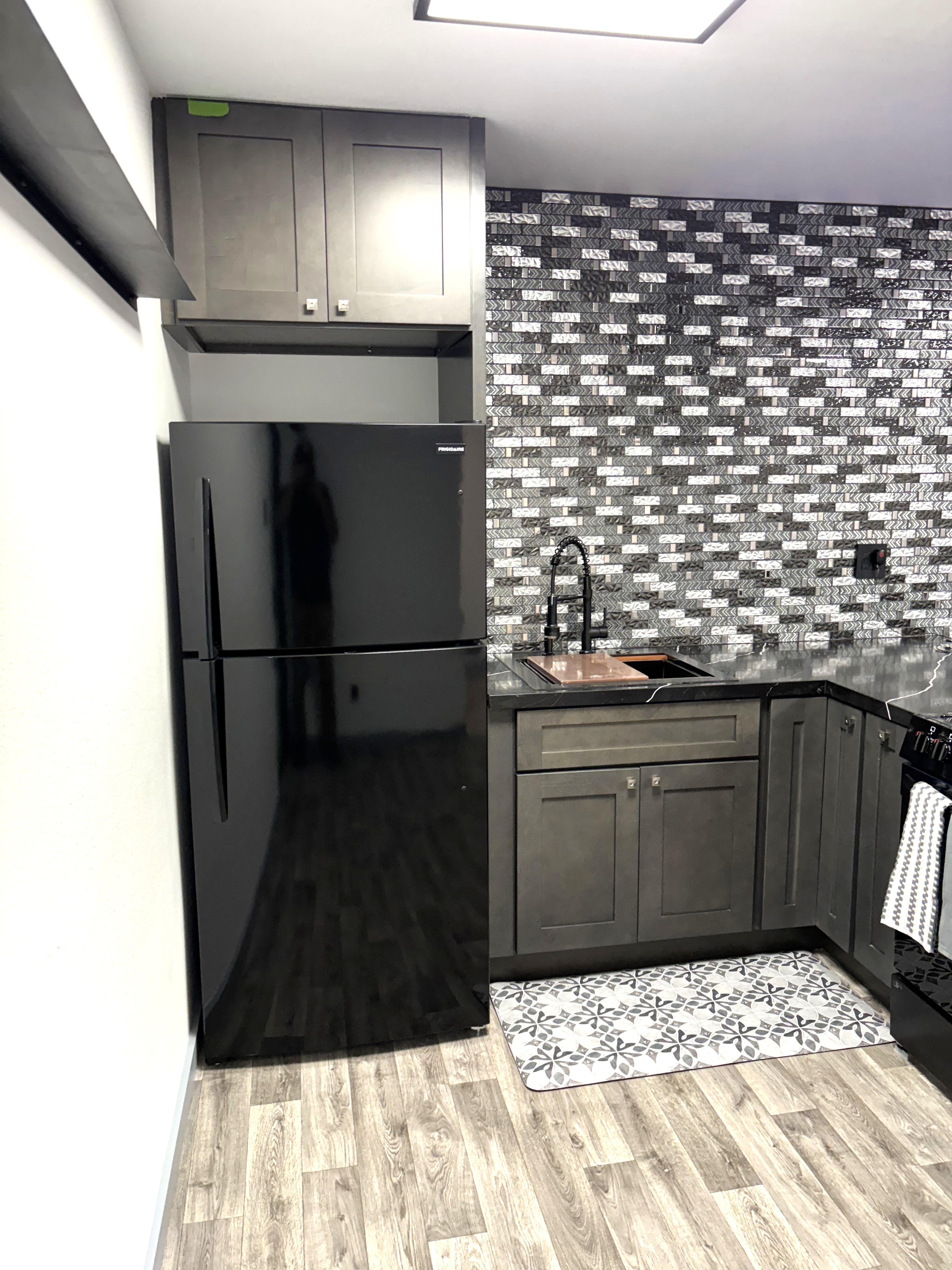 Kitchen cabinetry and refrigerator at 1654 25th Avenue