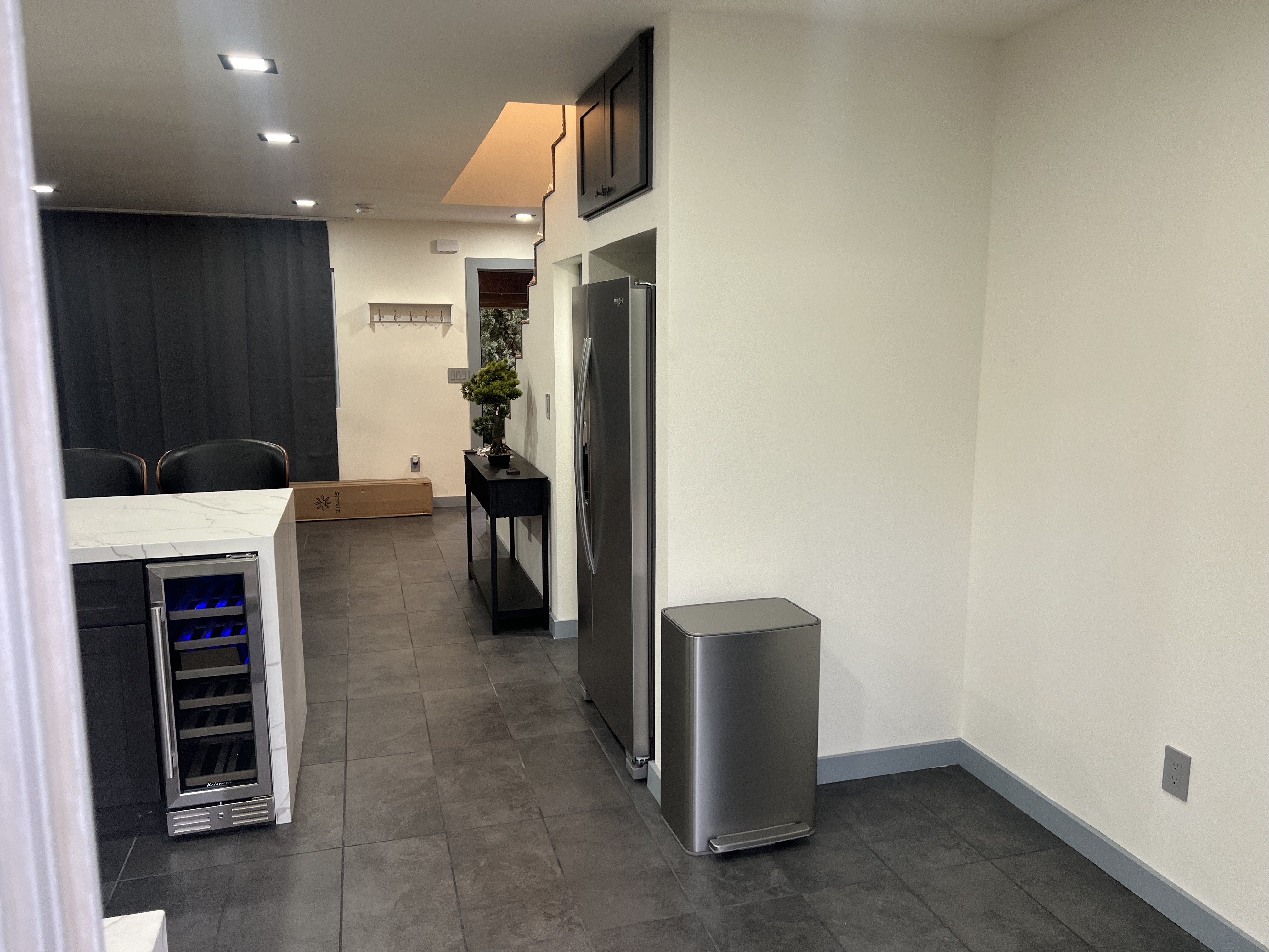 Kitchen appliance and living-area details at 3000 Nicol Avenue
