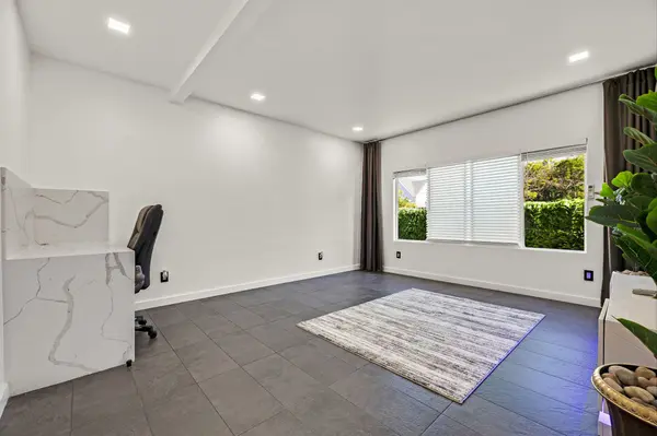Second apartment living area with desk