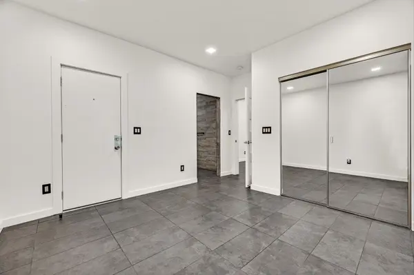 Bedroom with rear door at 2300 Fruitvale
