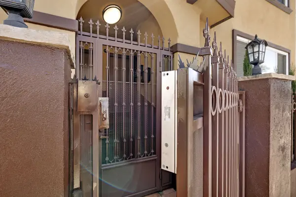 Close-up of secure entry gate