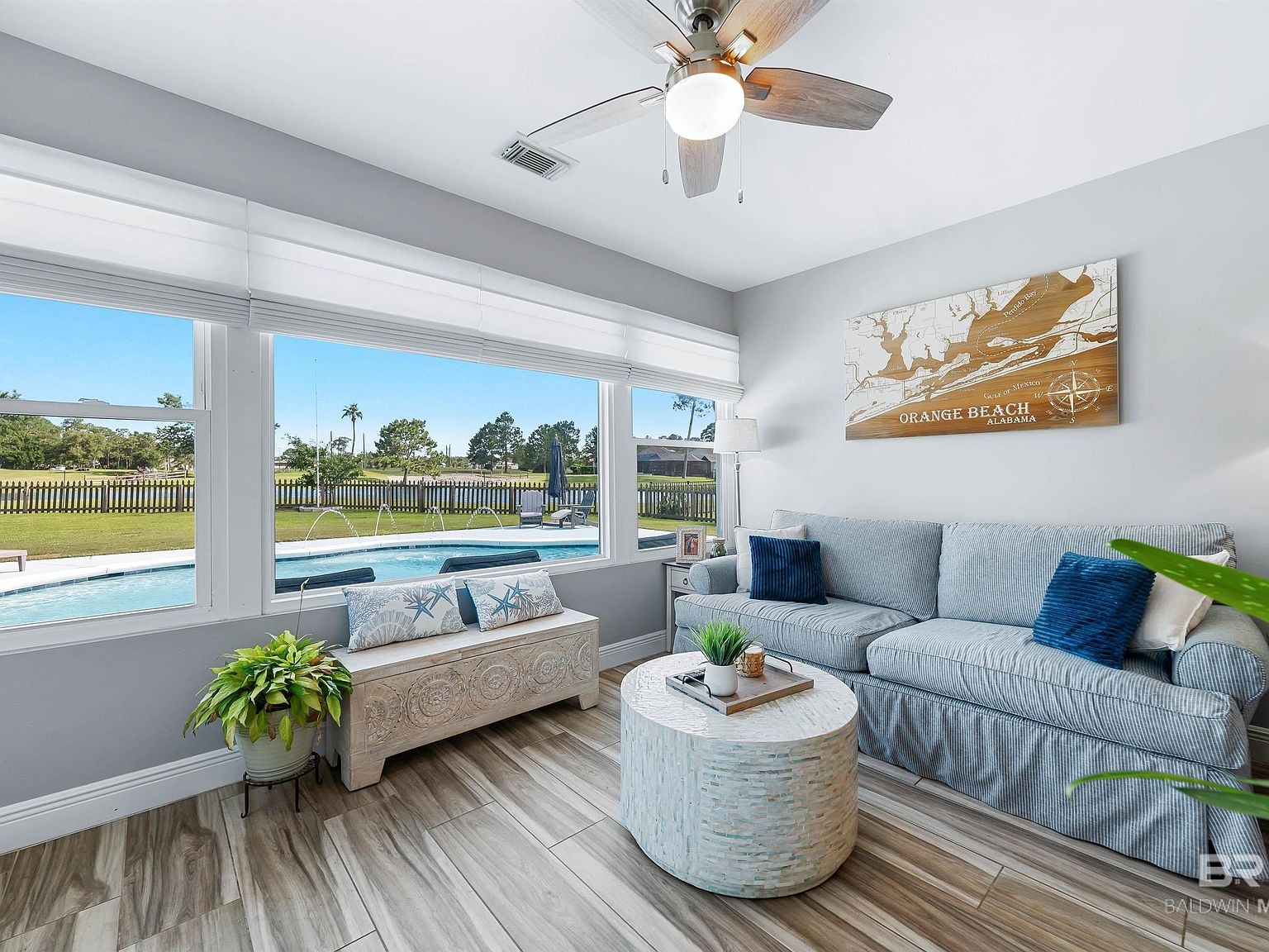 Living room with golf course view through large picture window