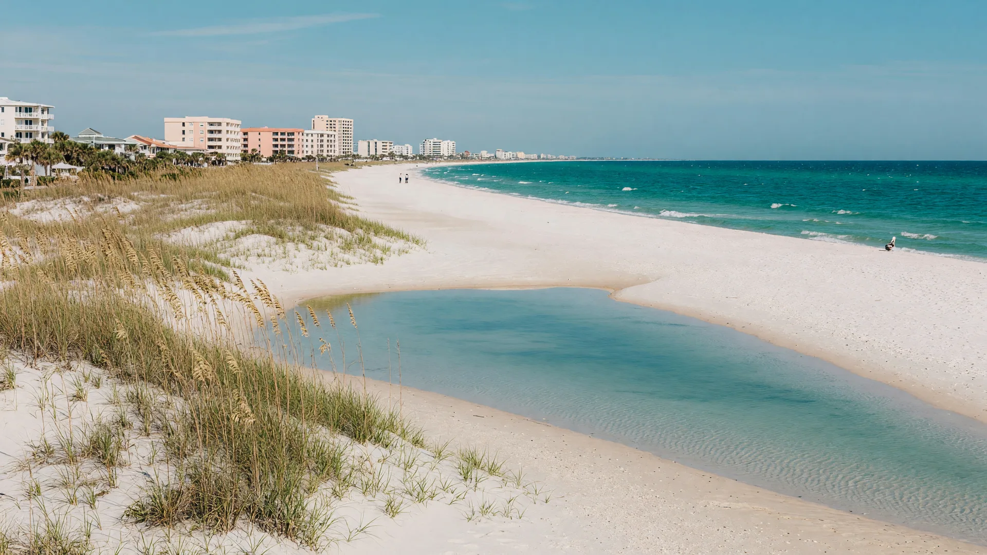 White sand beach at Perdido Key Florida with dunes and quiet condos