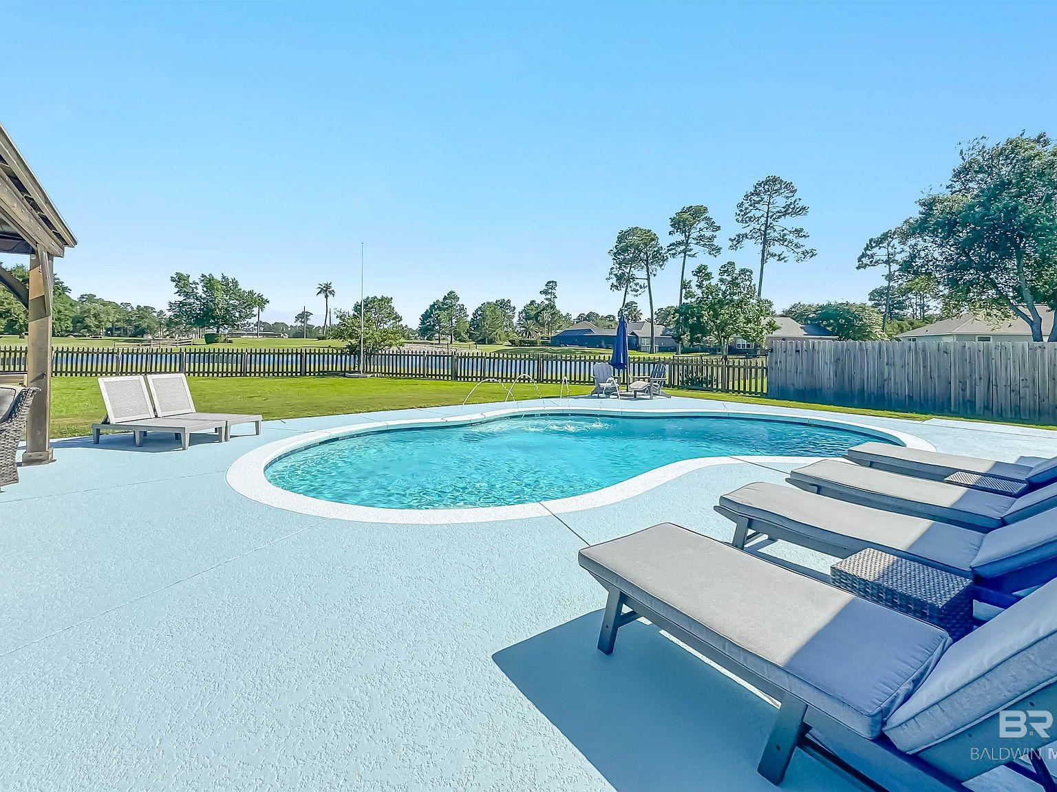 Saltwater pool in the backyard with cool-deck surround