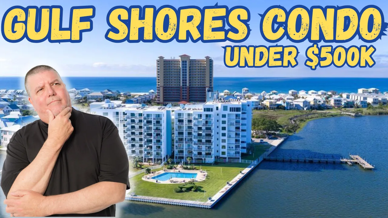 Waterfront condo complex on a lagoon in Gulf Shores with boats docked, palm trees, and sunny Gulf Coast atmosphere