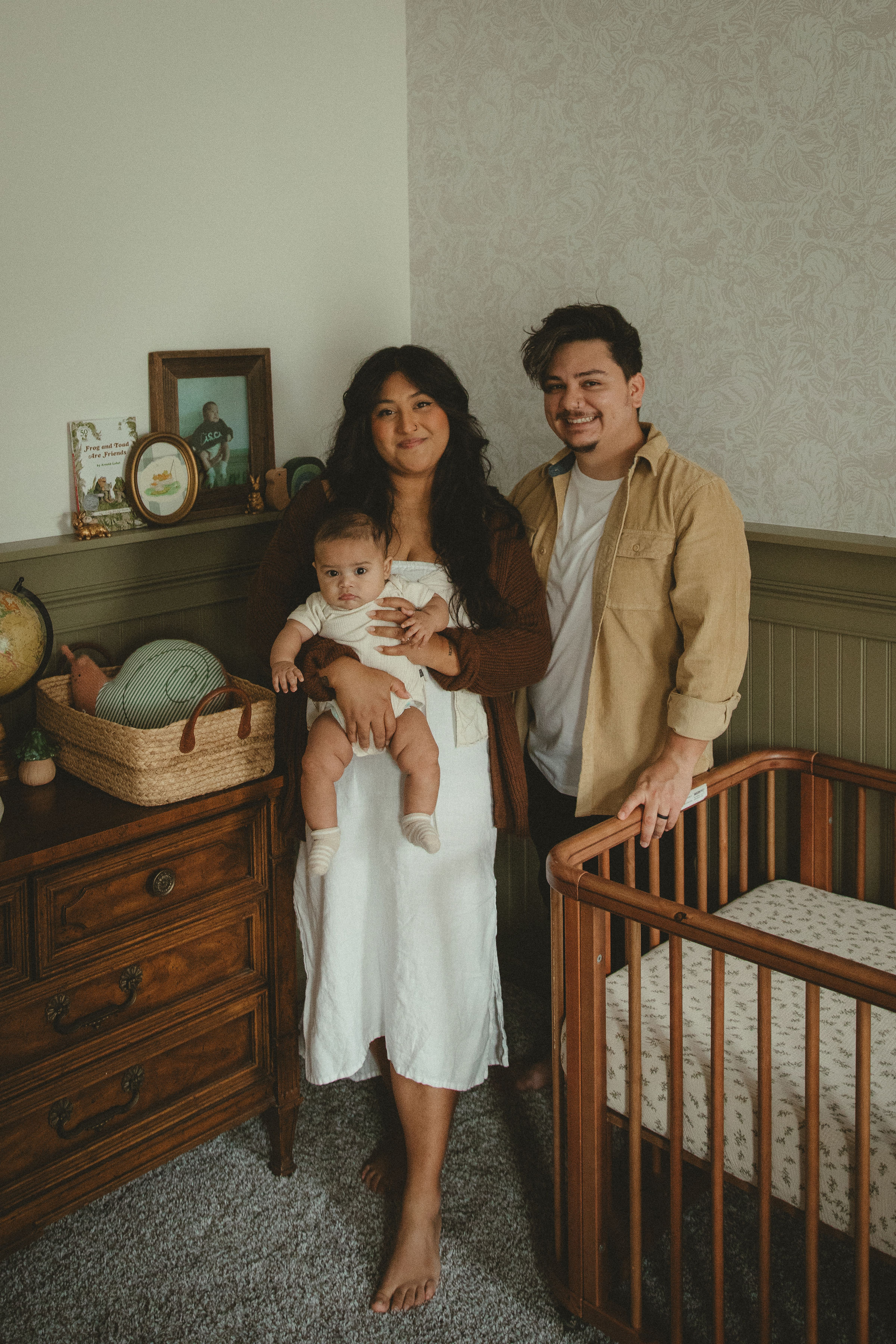Jen and Frankie Gilmore with their son Cisco in his nursery