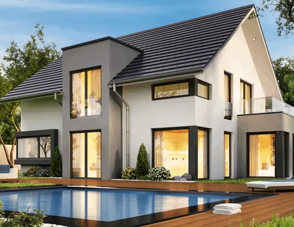 Modern luxury home exterior with large windows and swimming pool