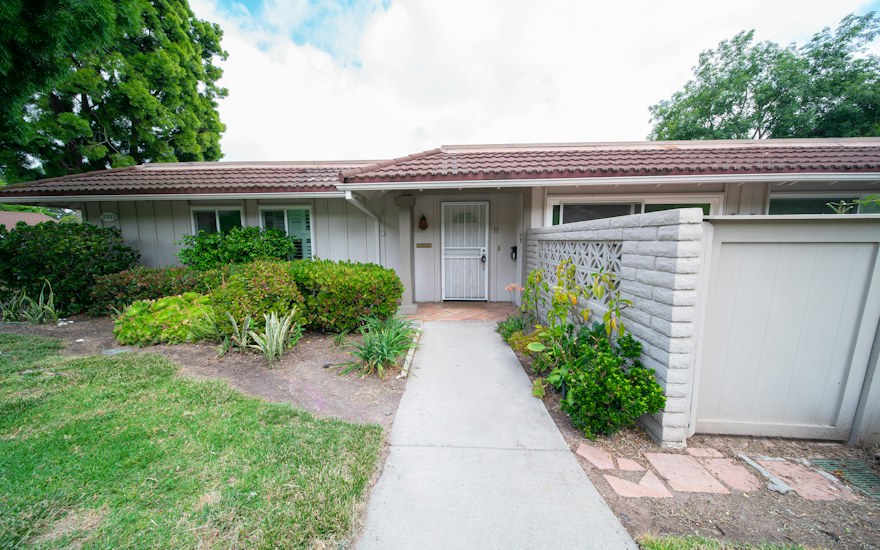 A single-family home with a front walkway in Davis, California