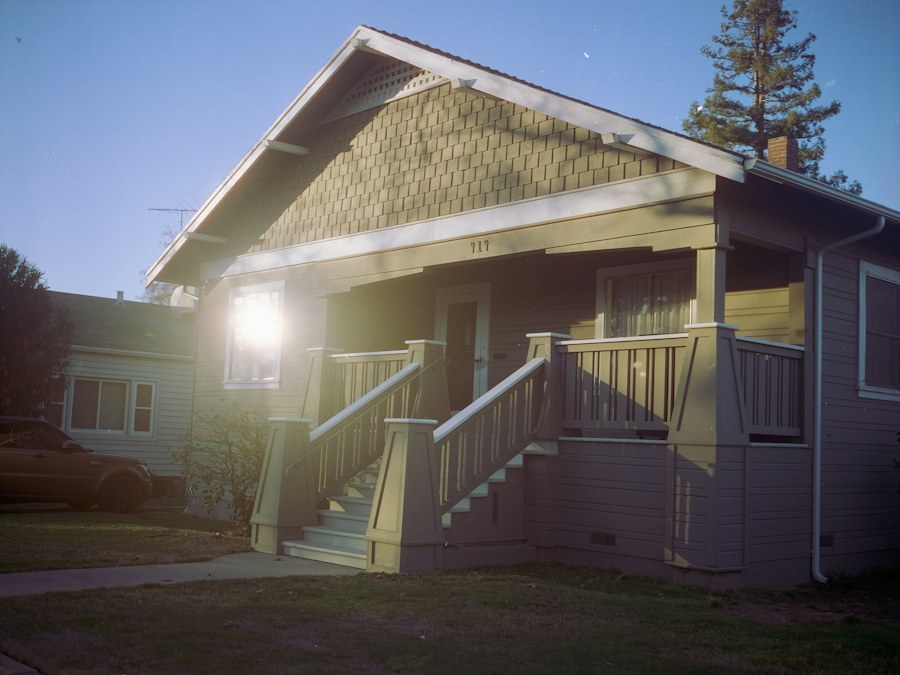 A white wooden house among green trees in Roseville, California