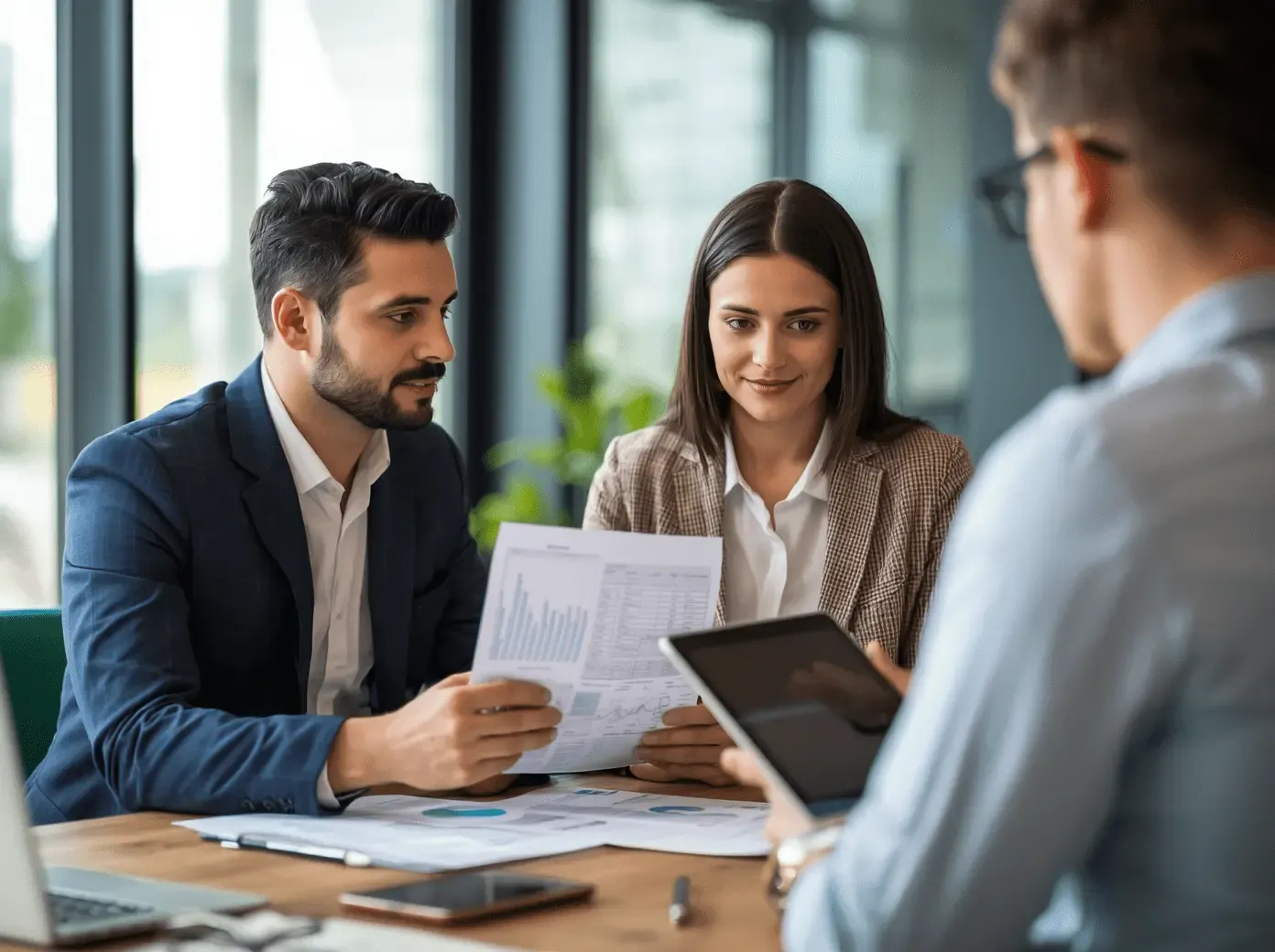 Real estate agent explaining costs to potential buyer