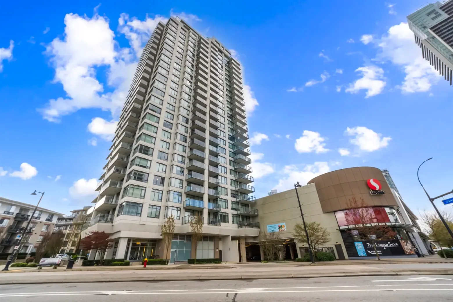 High-rise apartment building next to shopping center